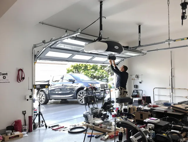 Coral Springs Garage Door Repair specialist installing smart garage door opener system in Coral Springs home